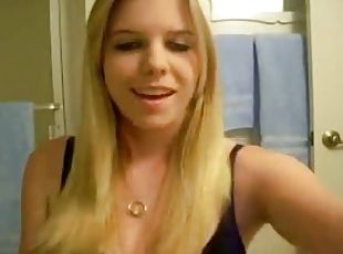 Blonde removing her black lingerie