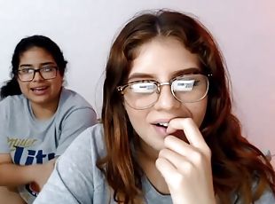 Two nerdy latinas playing with their pussies on cam