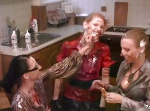 Naughty lesbians shower with their cloths on in harvested cum at th...