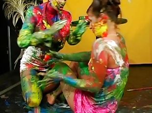 Girls make a mess painting each other and playing around