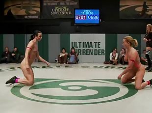 Lesbians finger each other's pussies while wrestling on tatami