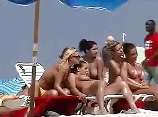 Nude beach hotties get filmed with a hidden cam while having rest