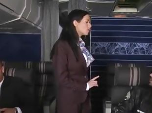 Clothed stewardesses fucked in first class