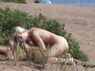 Voyeur couple has hot sex on the beach