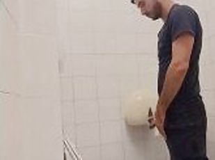 camera in the bathroom of a well-known company, man pisses with his...