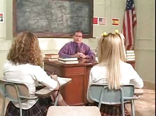 Schoolgirls on the desk having teacher sex