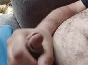 Hairy bear strokes on the couch and blows a sticky mess