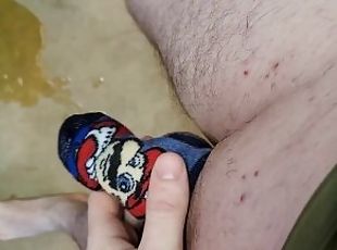 Pissing in cock sock then rubbing my dick in pee