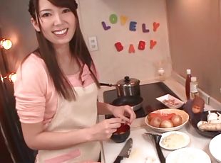 Smiley Japanese babe giving her man superb blowjob before having her pussy drilled with toy in the kitchen