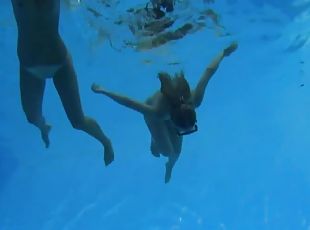 Swimming together in the pool before licking each other's pussies