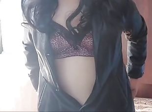 Shemale Kitty in leather coat, sunglasses and sexy bra with natural...