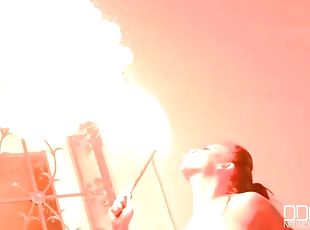 Topless big tits girl plays with fire