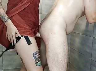 Strapon for a submissive mans ass after a shower