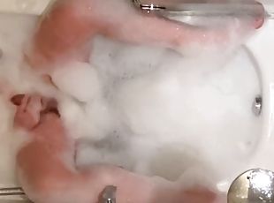 Shemale masturbating in the bathtub