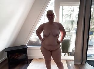 Stripping whore shows off her curves in front of the window, shakin...