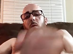 Very hairy bald daddy with glasses inserts a butt plug and jerks of...