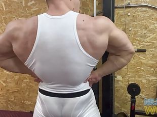 Bodybuilder Showing Off In The Gym