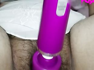 I have a long plug in my anus while I masturbate with my magic wand...