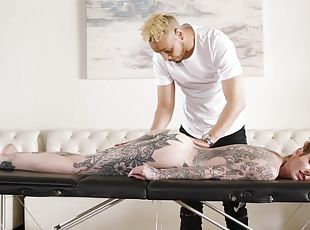 Lavishly tattooed slut Penny Archer gets fucked hard on the massage...