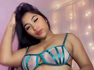 Amateur Latina dances in front of a camera and shows her curves