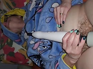 Before bed time, the wife masturbates using a magic wand