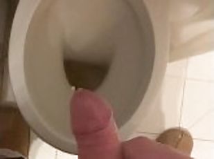 a guy pisses and then masturbates in the bathroom, cumming with his...