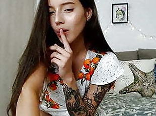 Sexy webcam girl moaning of pleasure in a sweet dress