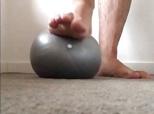 Super squishy gym ball under my big male feet tiny ball makes my fe...