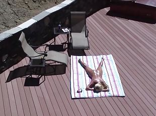 Big titties housewife sunbathing on her deck!