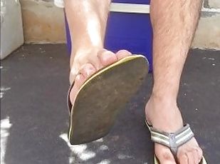 Worn out flip flops / thongs slapping against my naked male soles f...