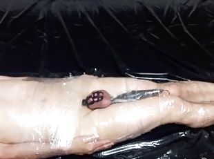 The mistress wraps the slave in plastic wrap and tortures him with ...