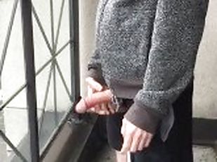 Skinny exhibitionist shows boner on public Toronto balcony while sm...