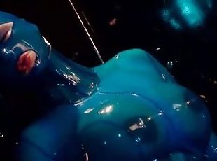 Heavy rubber goddess with big tits in transparent blue latex catsui...