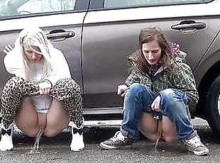 Blonde And Brunette Squat And Piss Together