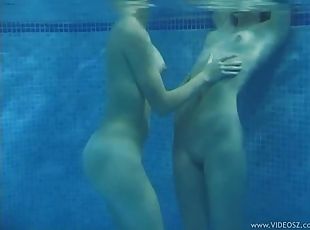 Teen Lesbians Playing With A Vibe In The Pool