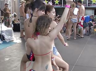 Tattooed pornstars in bikini dancing wildly in a party outdoor in reality shoot