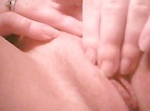 Horny amateur chick fingers her shaved pussy in close up solo clip