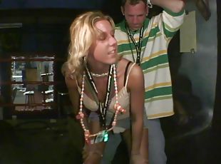Slutty blonde wearing a miniskirt flashes her pussy in a club