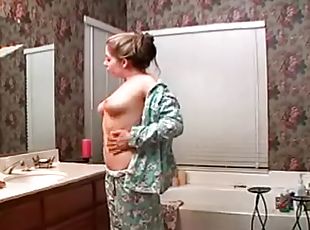 Busty Haley Scott takes a bath and plays with her pussy