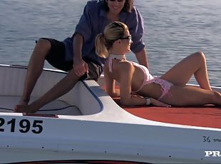 Smoking hot blondie is taking two huge cocks on the boat