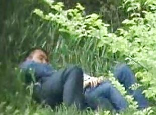 Horny couple feels an urge to caress each other in a park