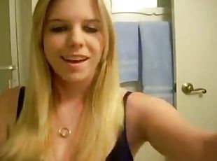 Blonde removing her black lingerie