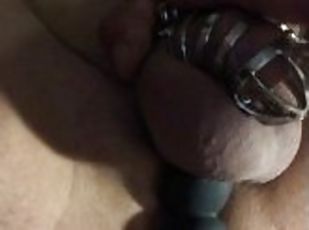 Poor guy is locked in a chastity so he uses a rotating prostate mas...