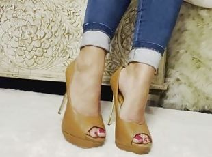 Sexy feet in heels with heel tapping and dangling