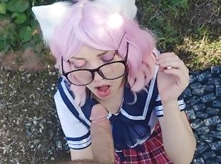 beautiful cute schoolgirl in a skirt and glasses walks and gives a ...