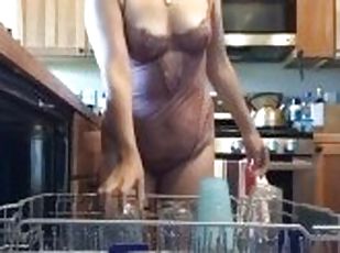 Horny milf does dishes and gets wet