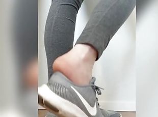 Taking off and playing with my sneakers with my sweaty, warm, bare feet