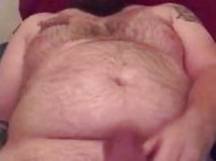 Chubby hairy tattooed daddy using a masturbation toy on his thick c...