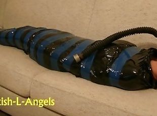 (SAFE AND VOLUNTARY), Mummification slave girl relaxing in her free...