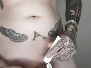 Tattooed guy with pierced dick